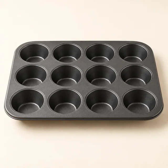 Eigene Illustration: Dunkles Muffinblech für zwölf kleine Kuchen